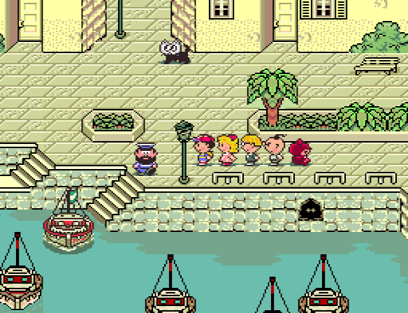 Ness and his friends prepare to depart from the port town of Toto to reach Scaraba.