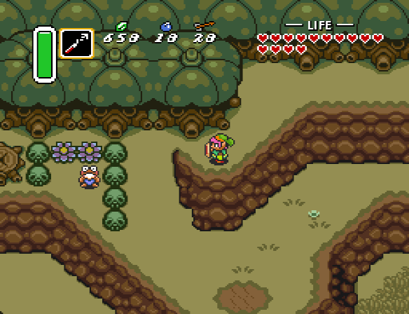 Link finds a frog-like person trapped behind black skulls, which Link can now lift with the Titan's Mitt.